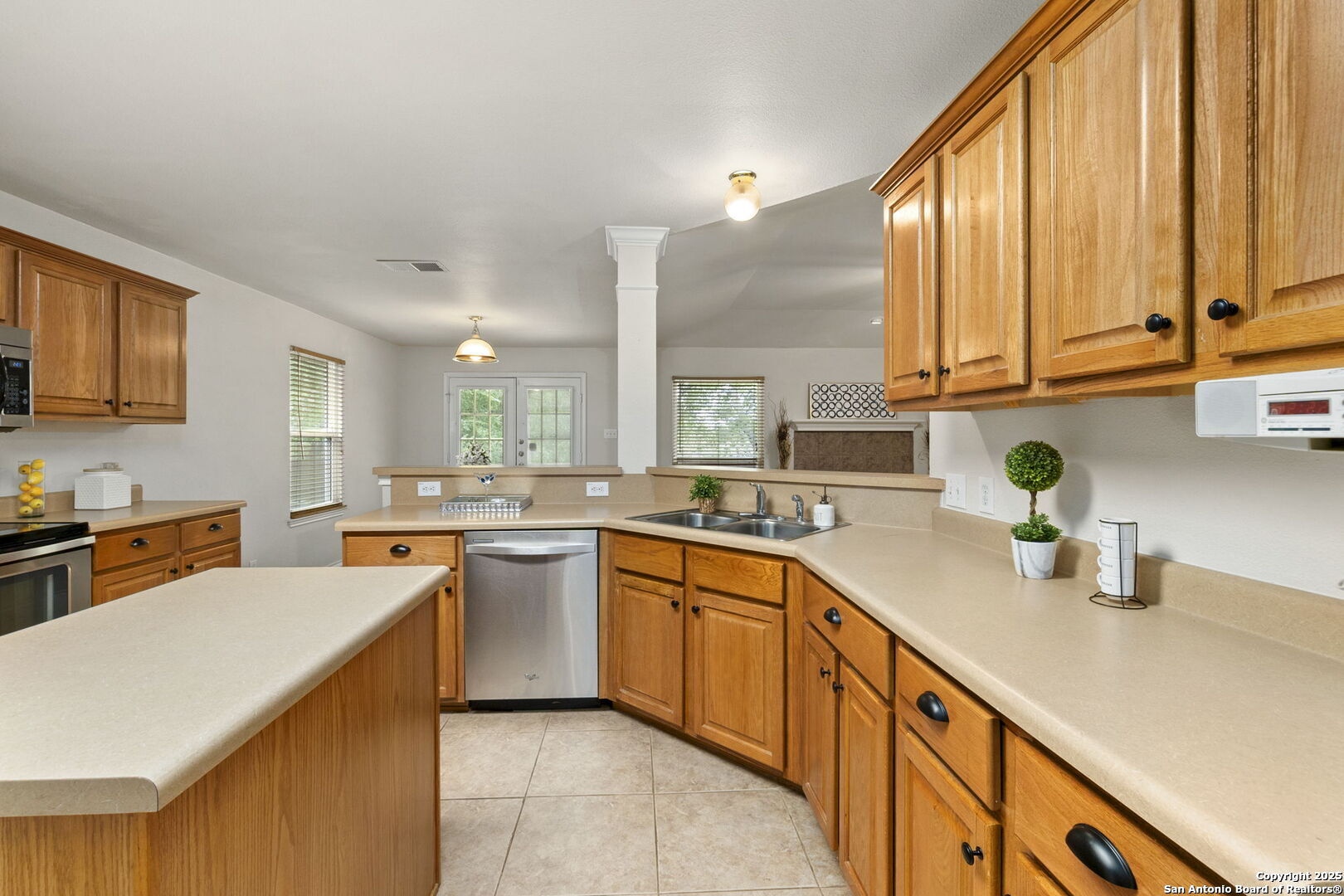 15311 Spring Rock San Antonio, TX 78247 - Photo 13 of 32 a kitchen with a sink stove and cabinets