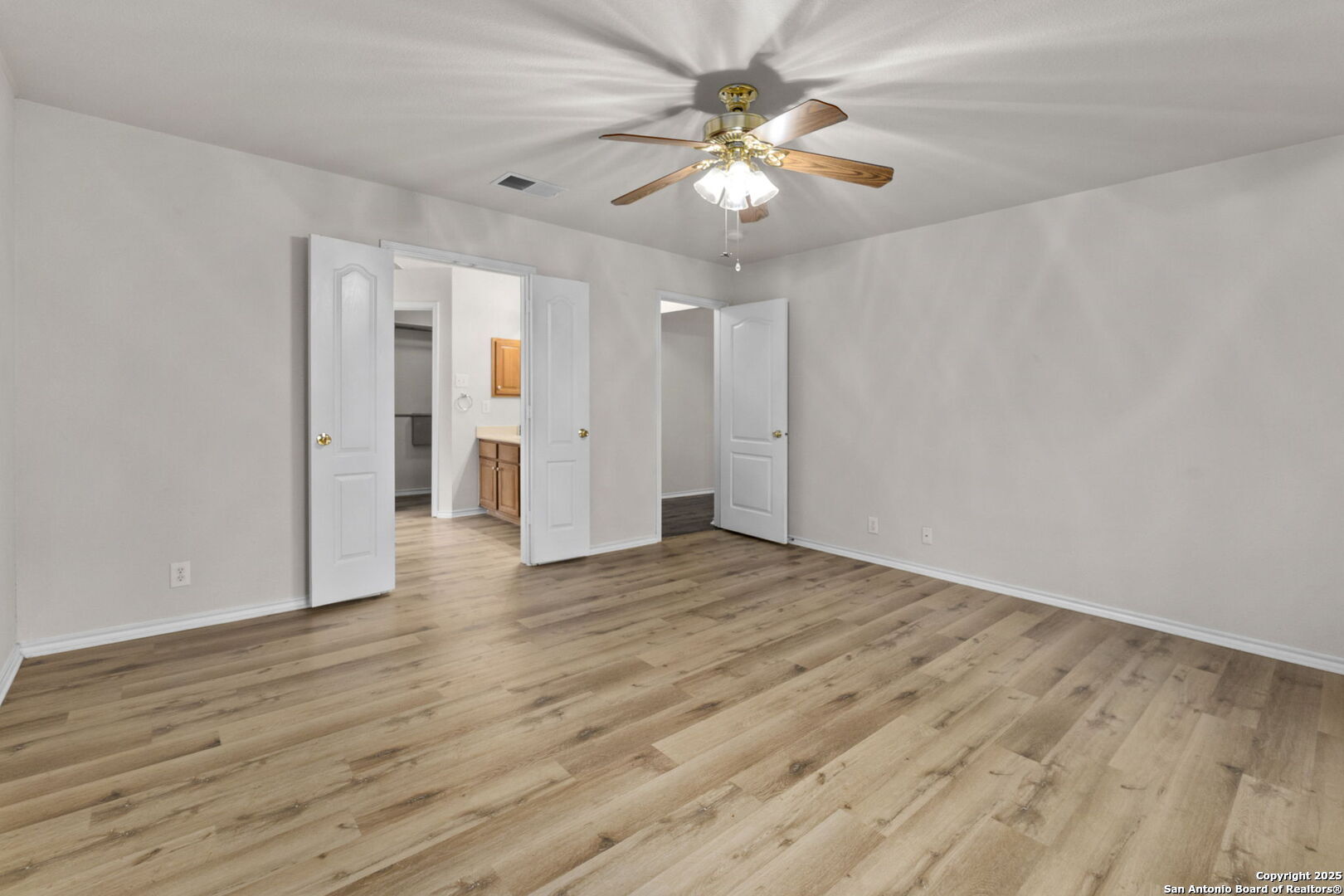15311 Spring Rock San Antonio, TX 78247 - Photo 16 of 32 a view of an empty room with wooden floor