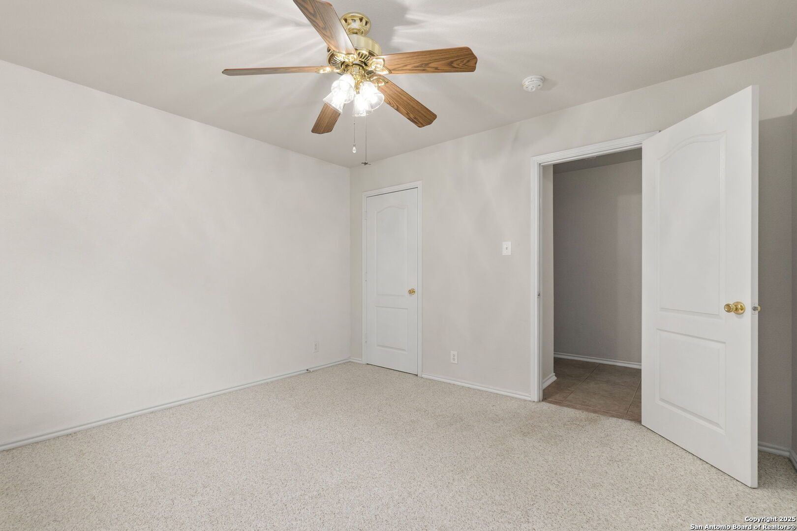 15311 Spring Rock San Antonio, TX 78247 - Photo 23 of 32 an empty room with chandelier fan
