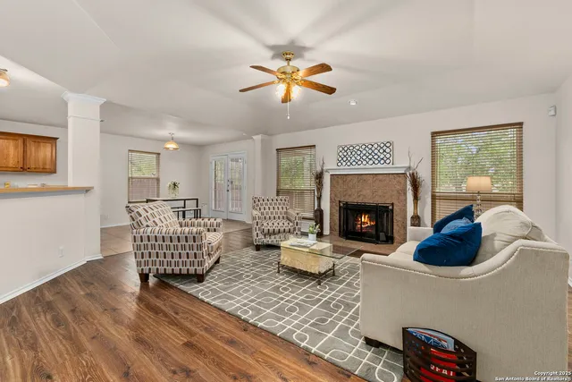 a living room with furniture and a fireplace