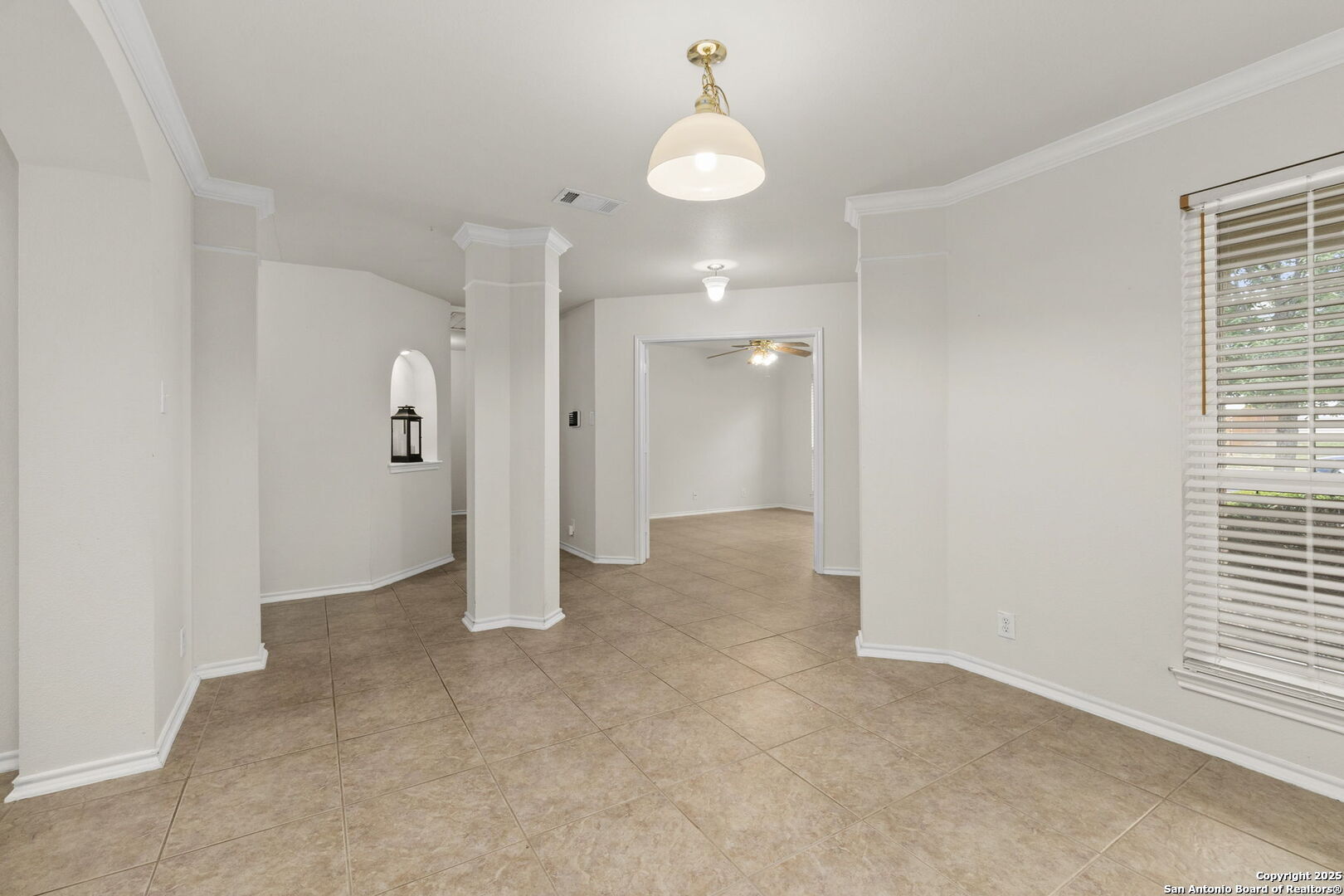 15311 Spring Rock San Antonio, TX 78247 - Photo 8 of 32 an empty room with fan and windows