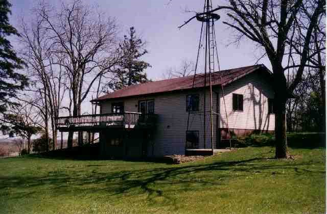 9045 East Greenvale Road Stockton, IL 61085 - Photo 2 of 8 a backyard of a house with lots of green space