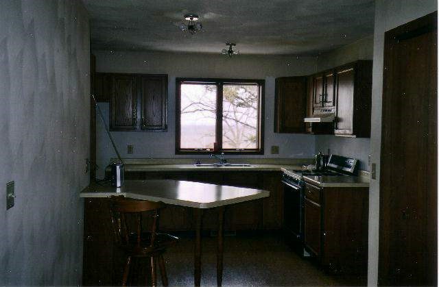 9045 East Greenvale Road Stockton, IL 61085 - Photo 3 of 8 a kitchen with a sink cabinets and a stove