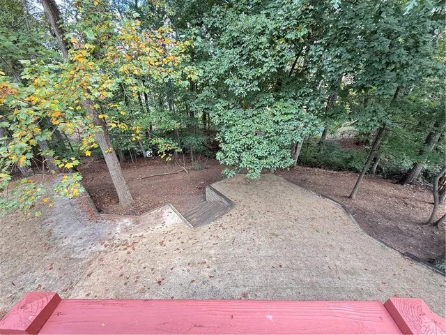 a view of a backyard with trees