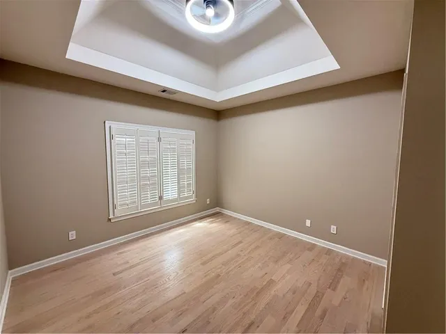 a white bath tub sitting next to a white toilet