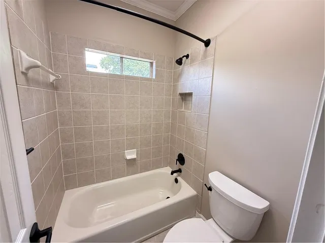 a spacious bathroom with a double vanity sink and mirror