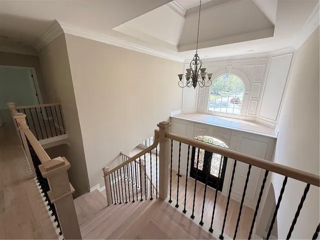 a view of a room with wooden floor and closet