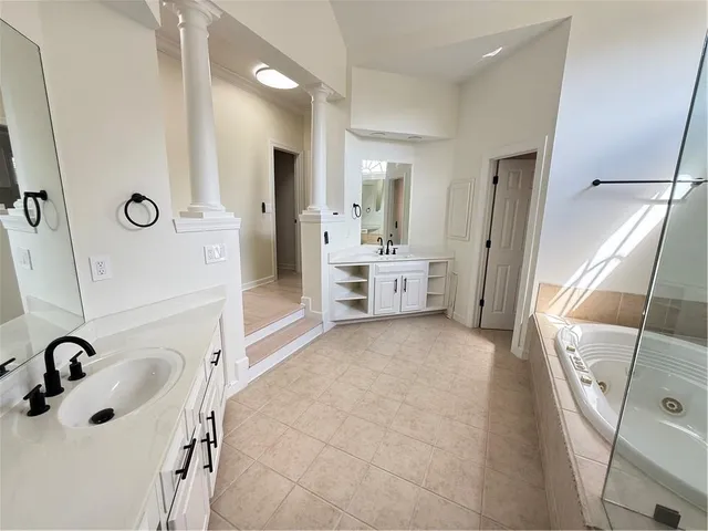 an empty room with a empty space and windows