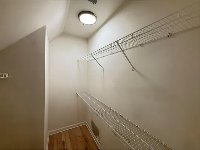 a view of a kitchen with a sink and cabinets
