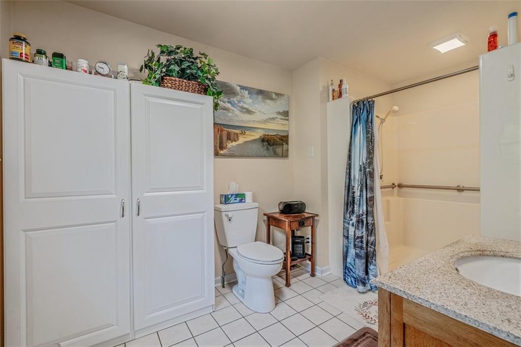 4101 Miracle Ridge Road Monongahela, PA 15063 - Photo 20 of 47 a bathroom with a granite countertop sink mirror and toilet