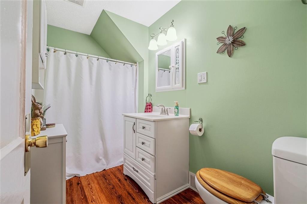 4101 Miracle Ridge Road Monongahela, PA 15063 - Photo 25 of 47 a bathroom with a sink mirror vanity and toilet