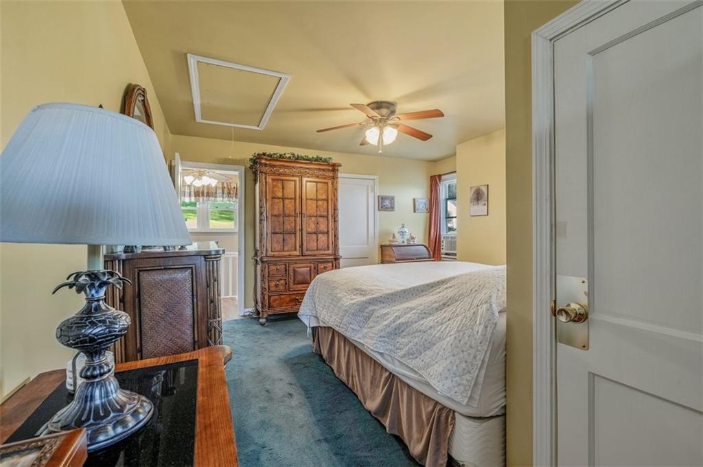 4101 Miracle Ridge Road Monongahela, PA 15063 - Photo 28 of 47 a bedroom with a bed and a chandelier