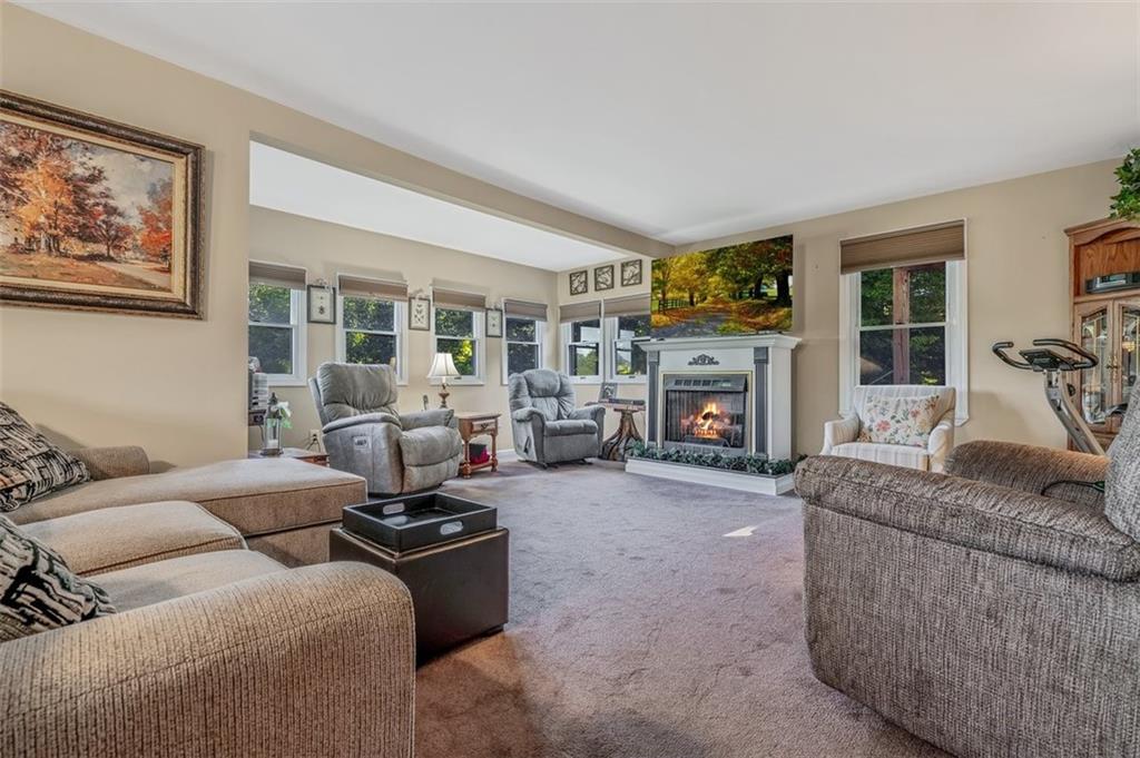 4101 Miracle Ridge Road Monongahela, PA 15063 - Photo 5 of 47 a living room with furniture a fireplace and a large window