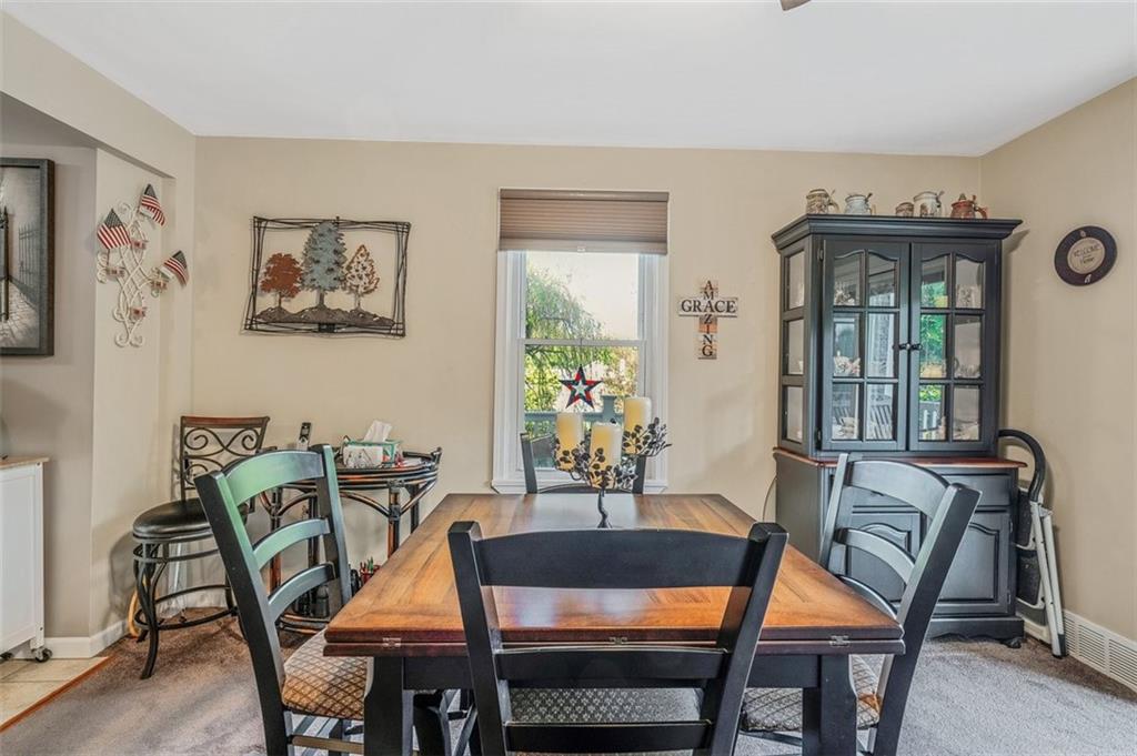 4101 Miracle Ridge Road Monongahela, PA 15063 - Photo 7 of 47 a view of a dining room with furniture window and wooden floor