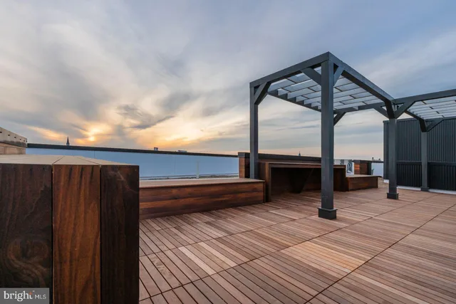 a view of swimming pool with seating space