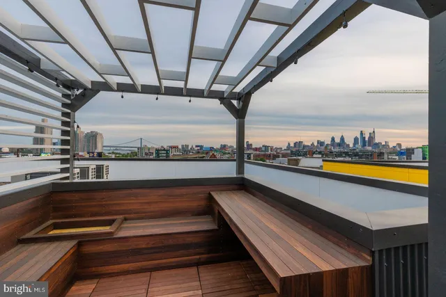 a view of balcony with wooden floor