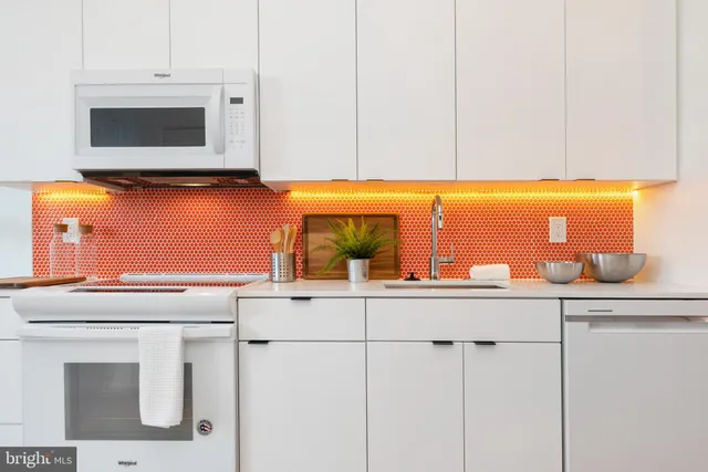 a kitchen with a sink and cabinets