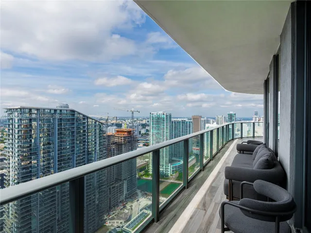 a view of a balcony with city view