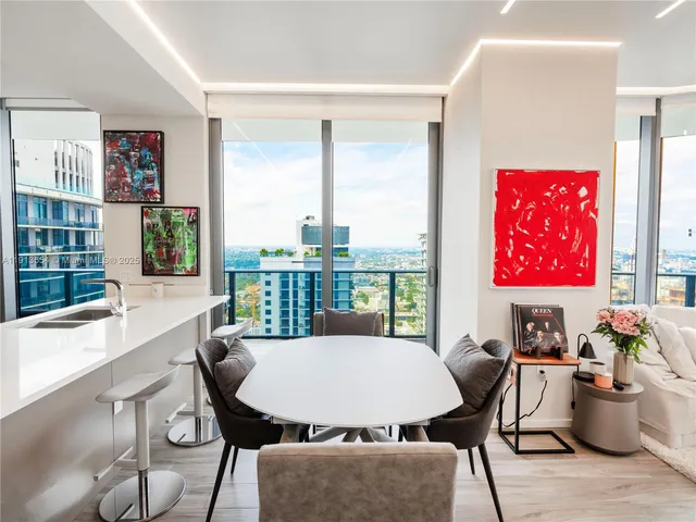 a view of a dining room with furniture window and outside view