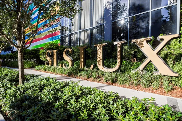 a backyard of a house with lots of green space and fountain
