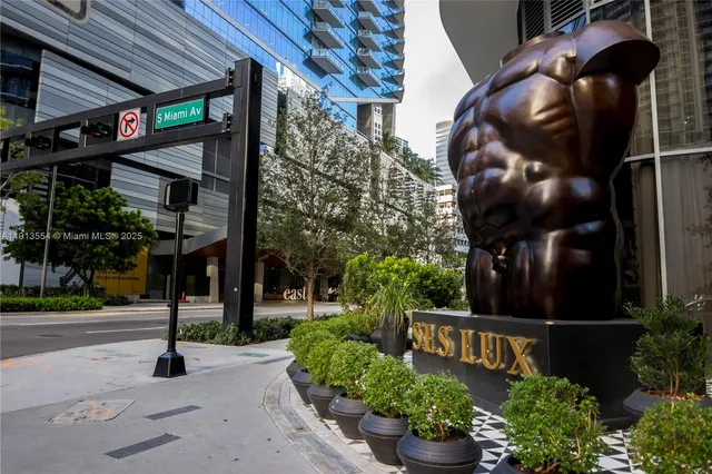a view of street along with retail shop and buildings