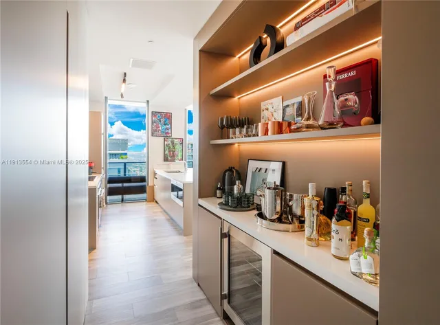a hallway with wine glasses in it