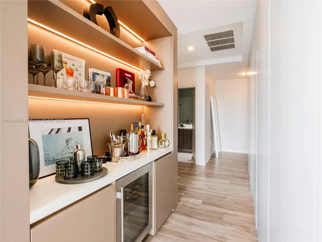 a kitchen with stainless steel appliances a sink and cabinets