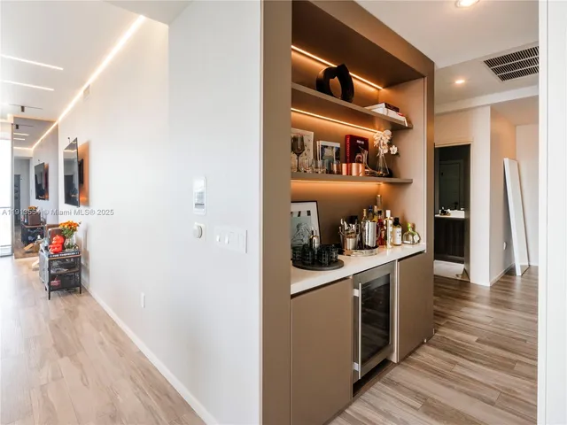 a kitchen with stainless steel appliances granite countertop a refrigerator and a stove