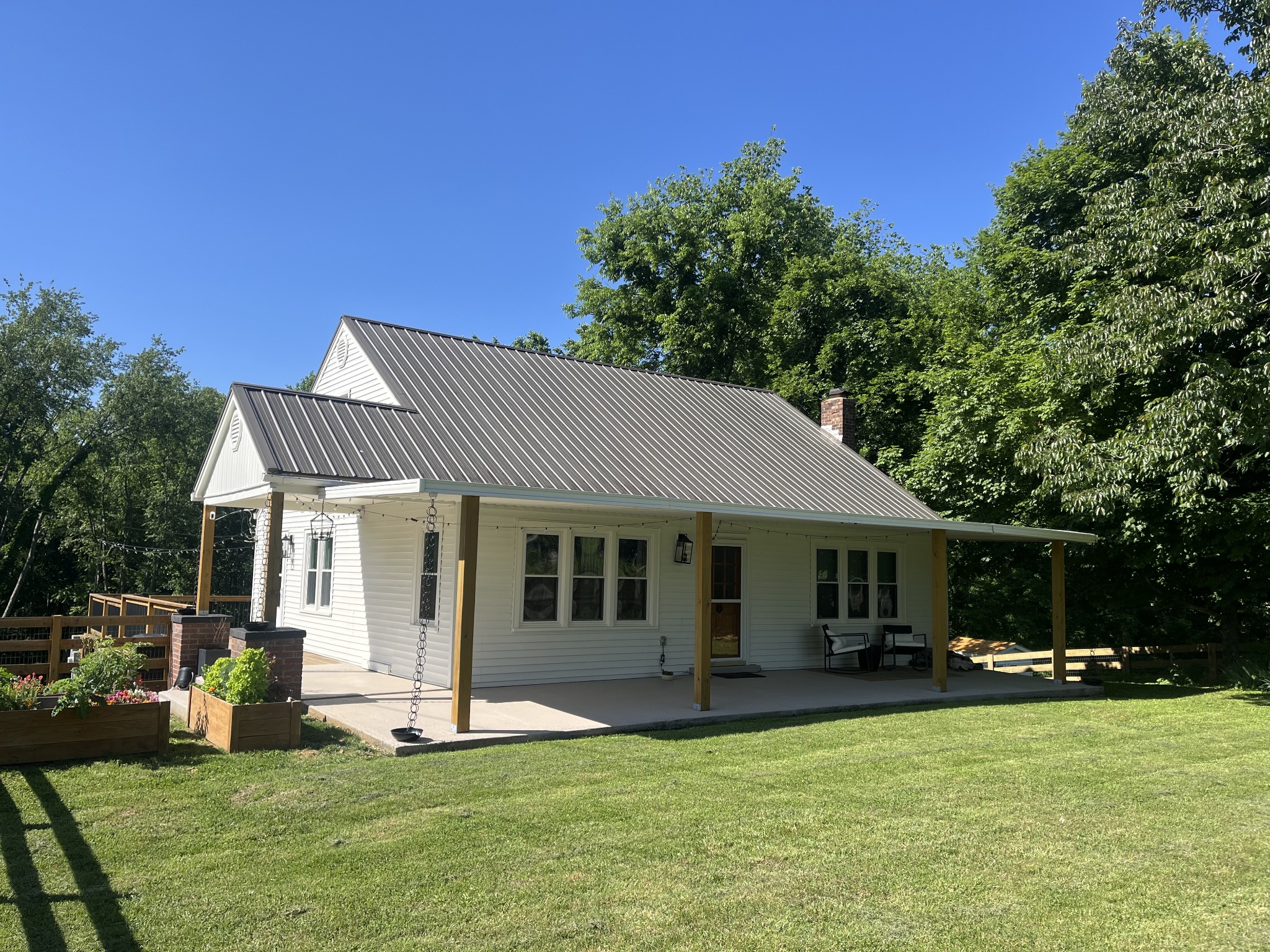 2349 Les Robinson Road Columbia, TN 38401 - Photo 4 of 5 a front view of a house with a yard patio and green space