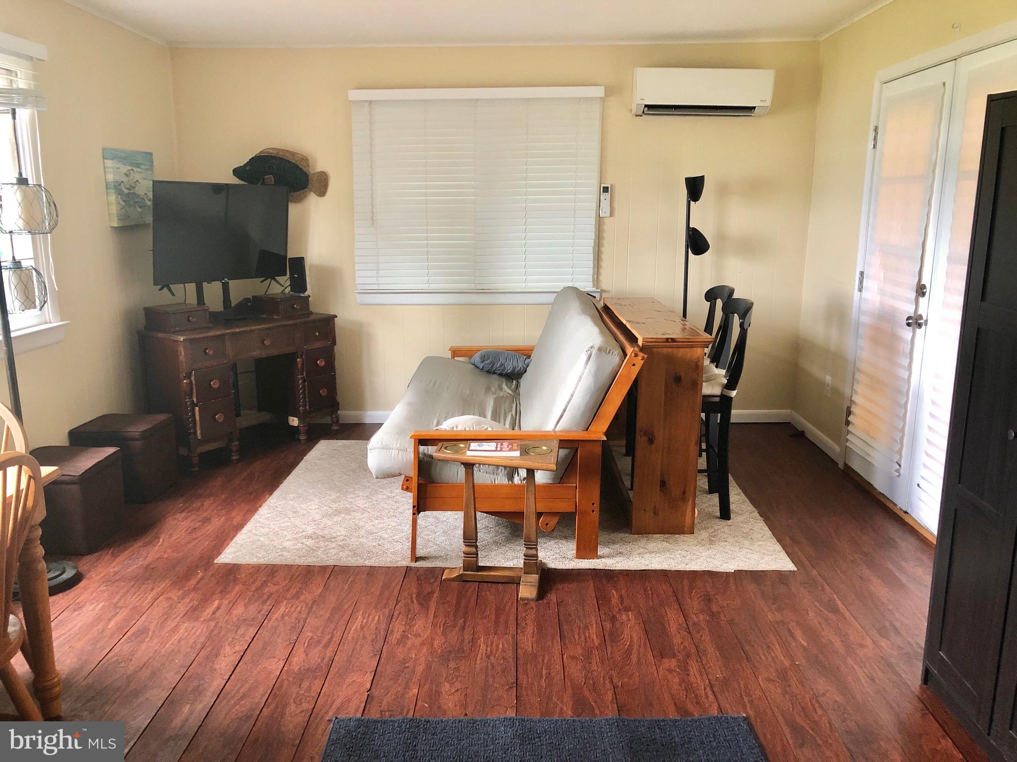 332 Arbutus Drive Edgewater, MD 21037 - Photo 11 of 31 a living room with furniture and a wooden floor