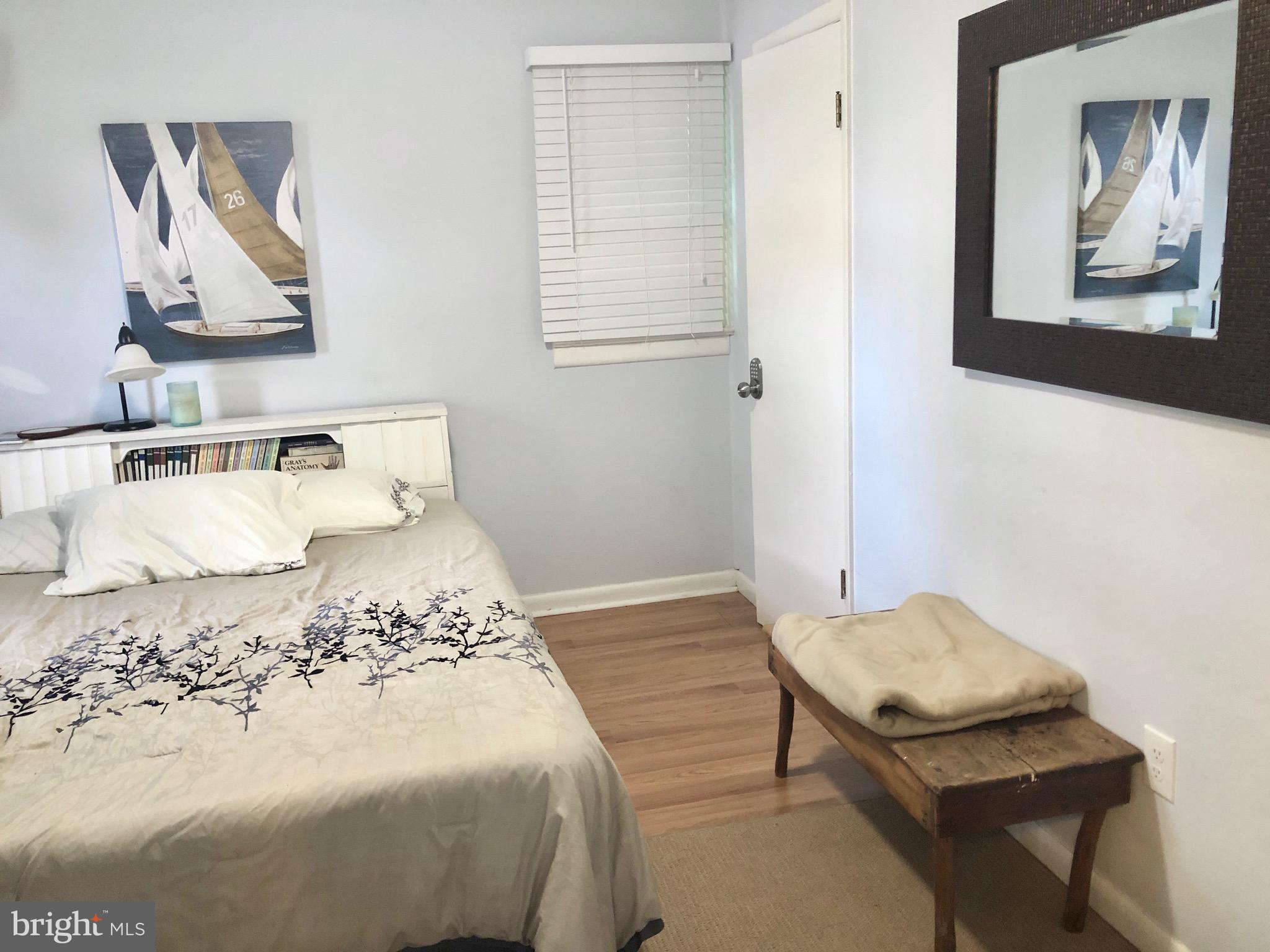 332 Arbutus Drive Edgewater, MD 21037 - Photo 13 of 31 a bedroom with a bed and painting on the wall