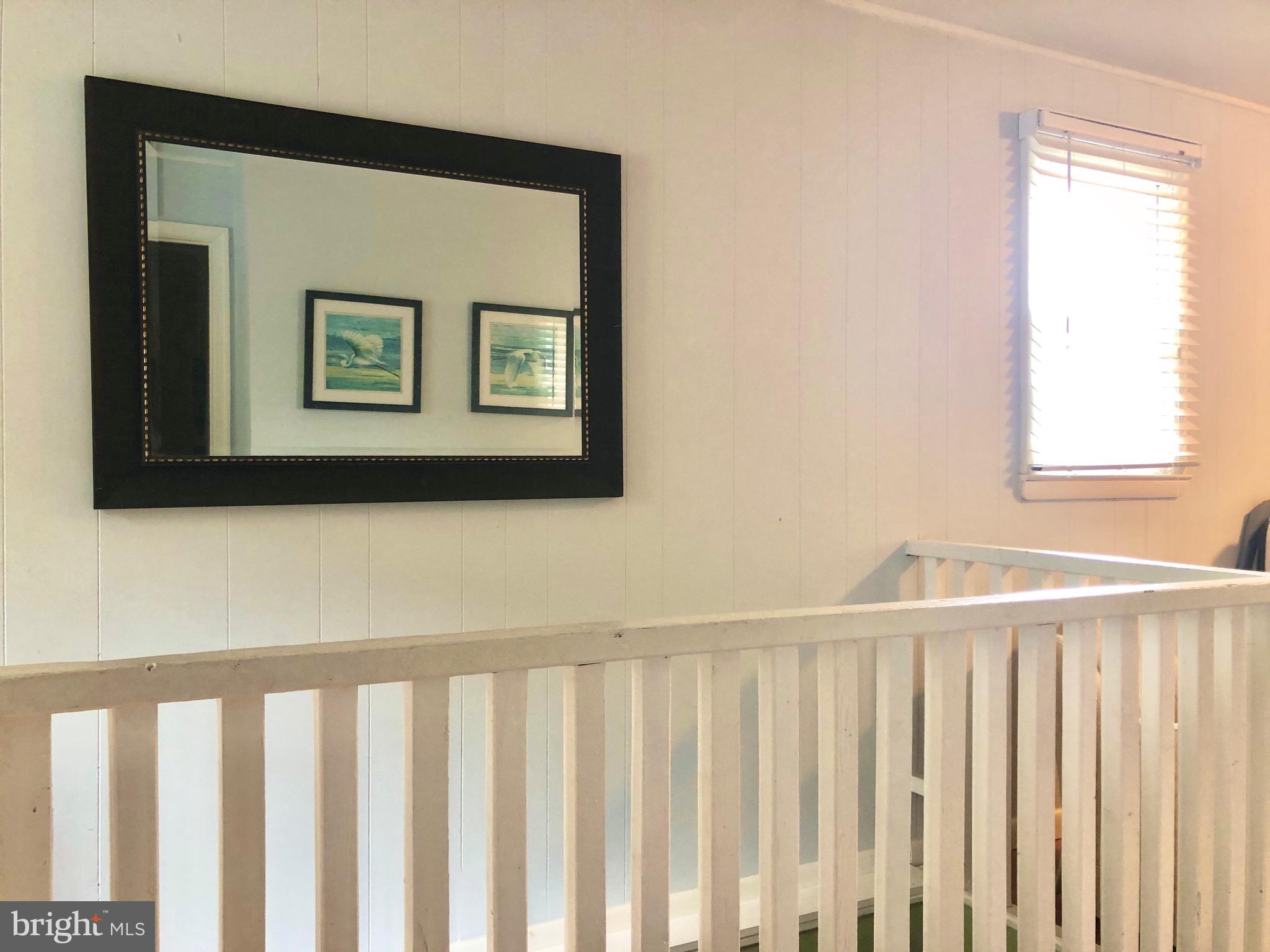 332 Arbutus Drive Edgewater, MD 21037 - Photo 16 of 31 a view of a hallway with wooden floor and a window