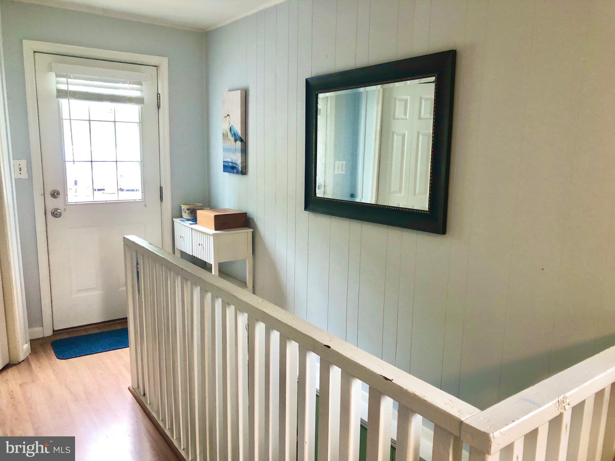 332 Arbutus Drive Edgewater, MD 21037 - Photo 17 of 31 a view of a hallway with wooden floor and entryway