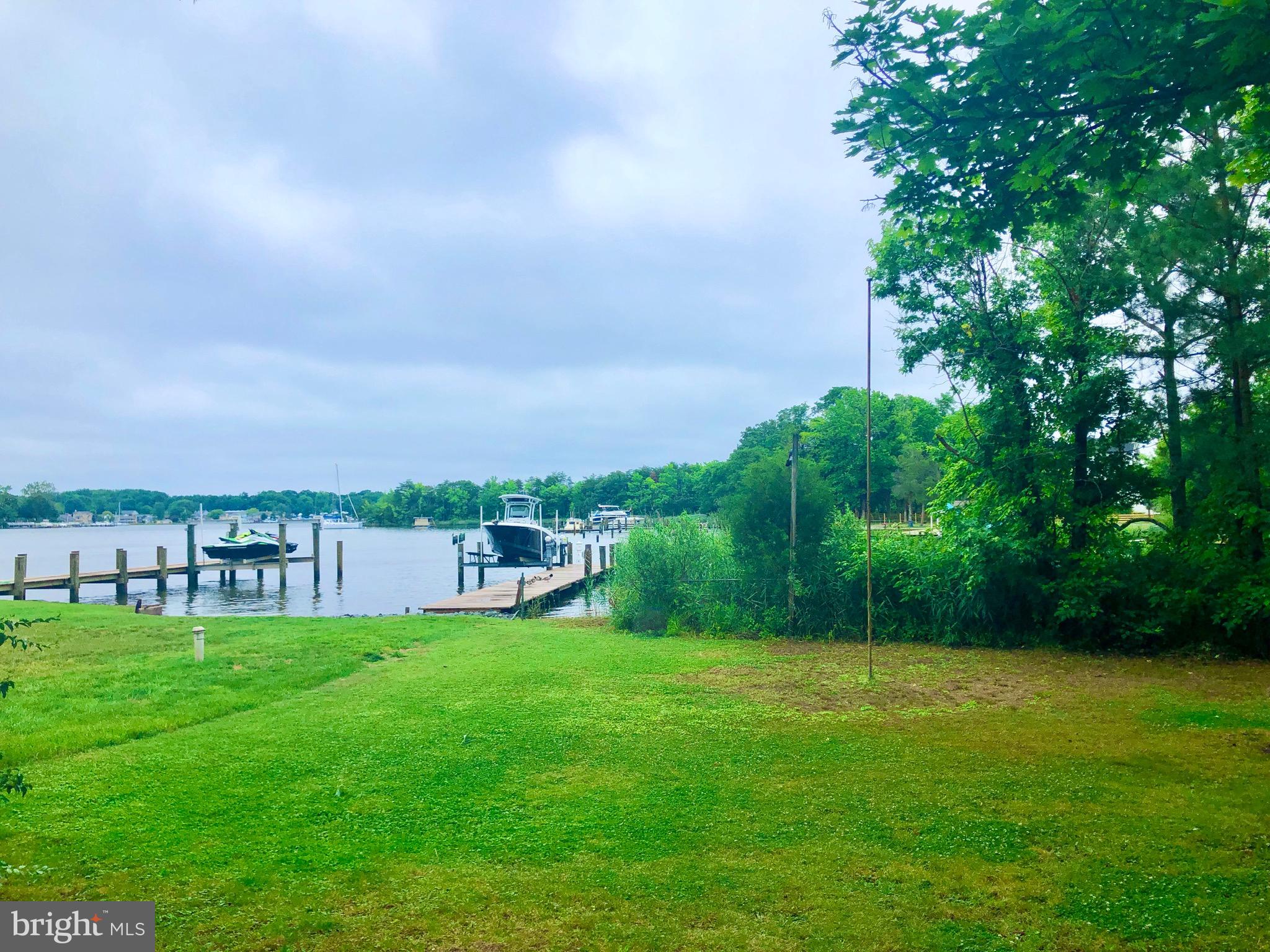332 Arbutus Drive Edgewater, MD 21037 - Photo 22 of 31 a view of a garden with a building in the background