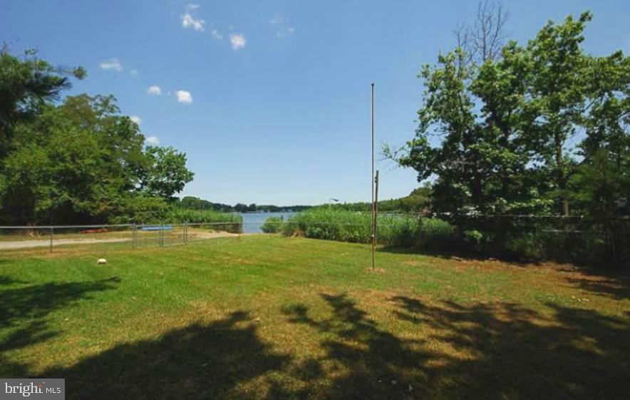 332 Arbutus Drive Edgewater, MD 21037 - Photo 26 of 31 a view of a green field with lots of bushes