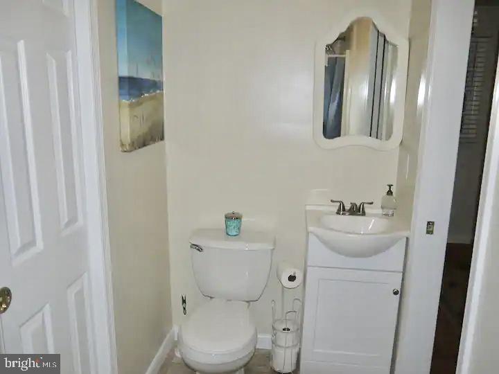 332 Arbutus Drive Edgewater, MD 21037 - Photo 8 of 31 a white toilet sitting next to a bathroom sink