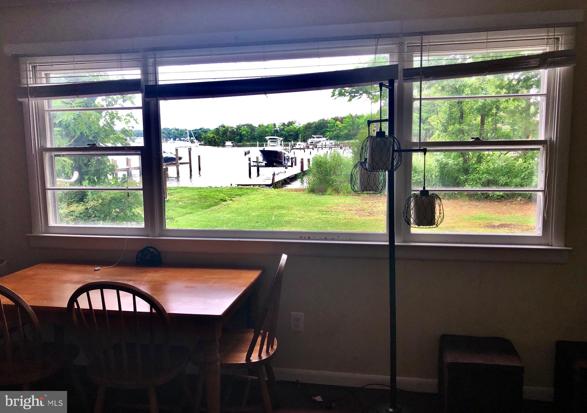 332 Arbutus Drive Edgewater, MD 21037 - Photo 9 of 31 a view of a large window with a table in balcony