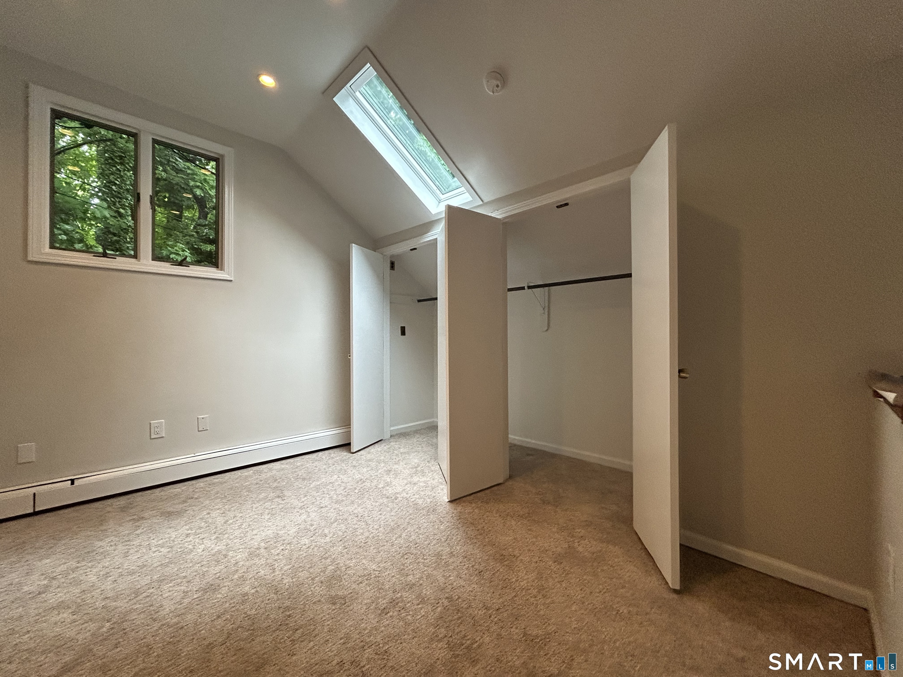236 Wire Mill Road Stamford, CT 06903 - Photo 3 of 11 an empty room with windows and closet