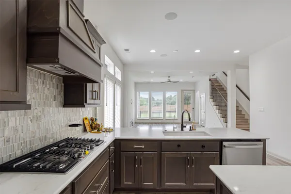 a kitchen with a sink and cabinets