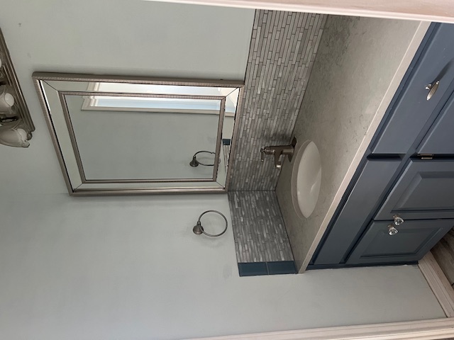 1001 Schubert Lane Kyle, TX 78640 - Photo 13 of 19 a bathroom with a sink and a mirror