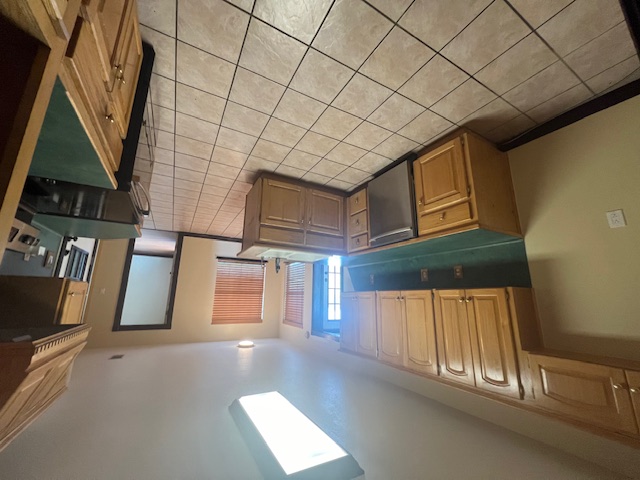 1001 Schubert Lane Kyle, TX 78640 - Photo 16 of 19 a kitchen with stainless steel appliances a sink a stove top oven a counter space and cabinets