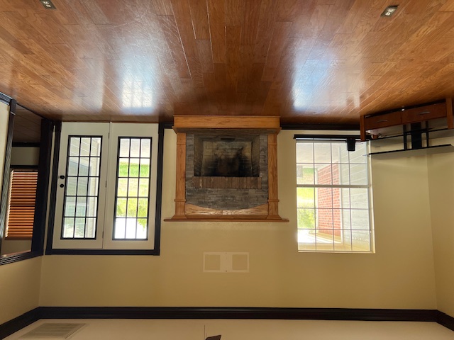 1001 Schubert Lane Kyle, TX 78640 - Photo 19 of 19 a view of an empty room with wooden floor and a window