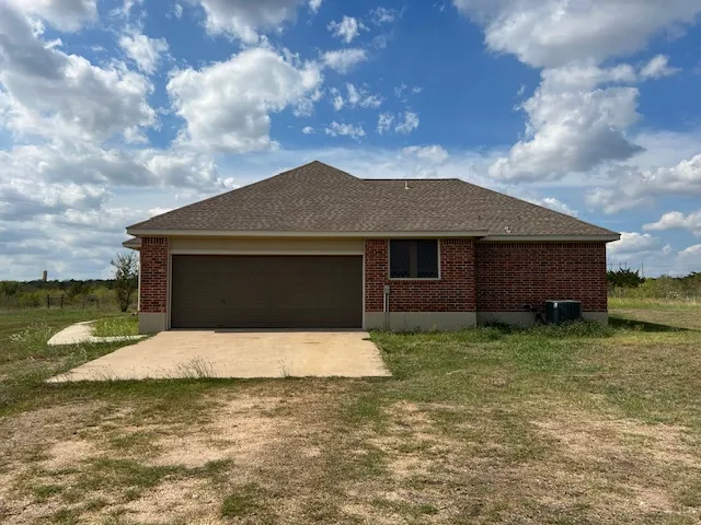a house with yard in front of it