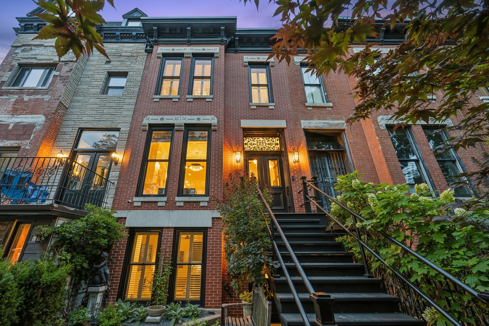 a view of a brick building next to a yard