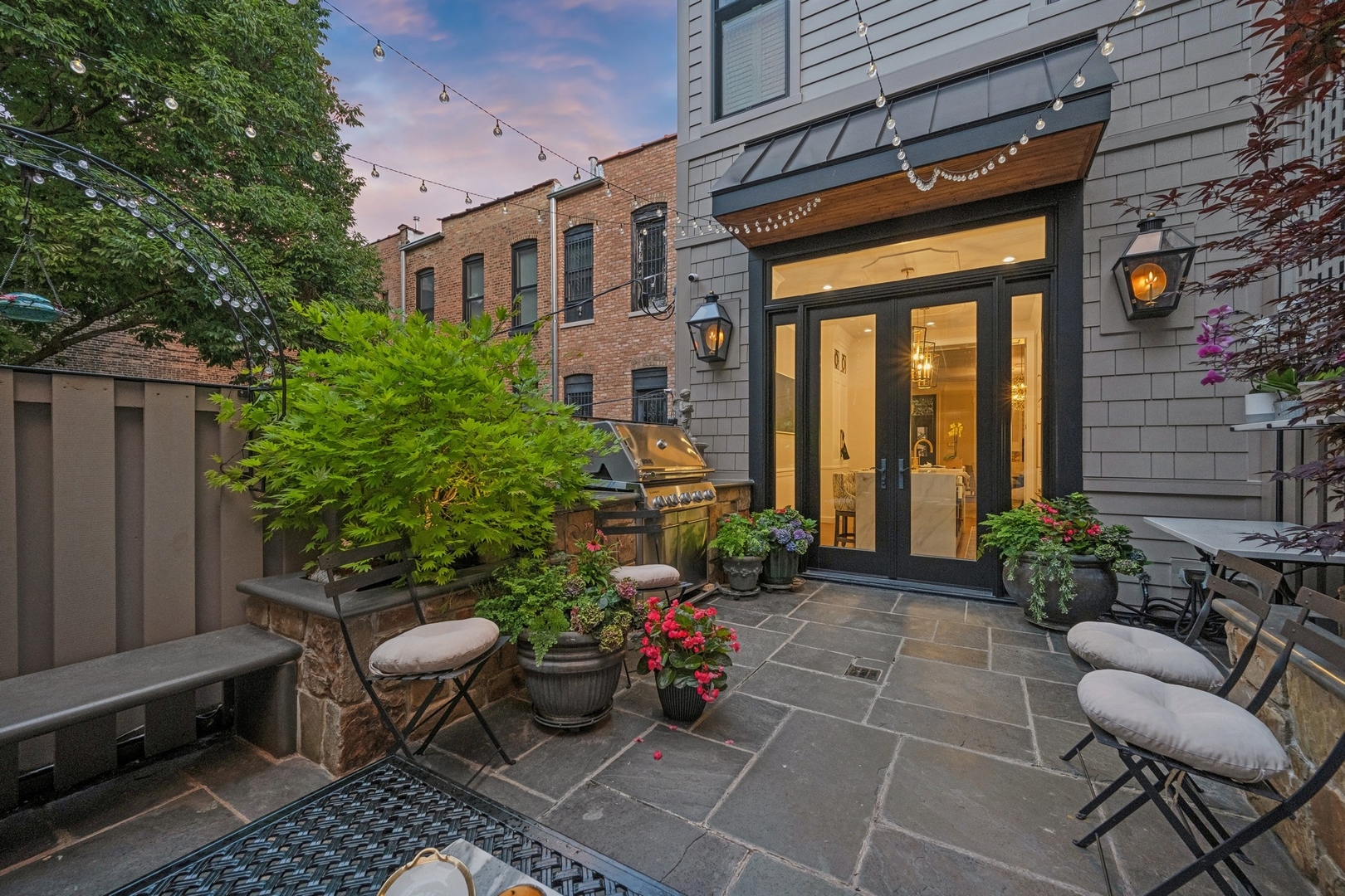 558 West Fullerton Parkway Chicago, IL 60614 - Photo 35 of 40 a view of a patio with couches table and chairs and potted plants