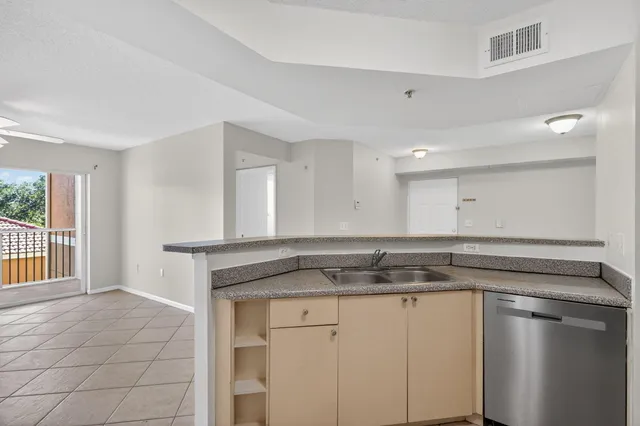 an empty room with a ceiling fan and a ceiling fan