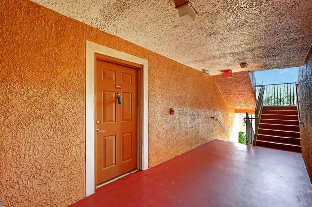 a view of kitchen with microwave and cabinets