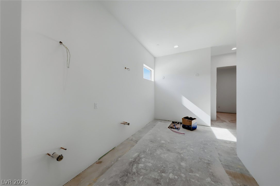 1140 Julie Road Henderson, NV 89002 - Photo 48 of 71 Clean, neutral walls offer a blank canvas in this utility space awaiting its final touches.