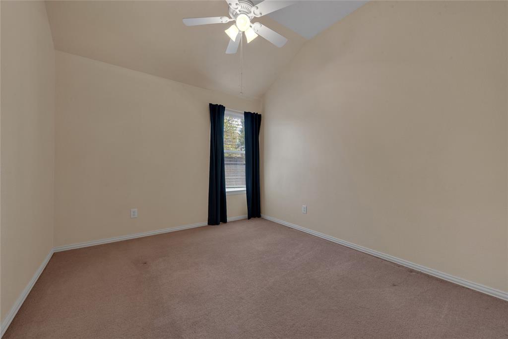 910 Derby Court Celina, TX 75009 - Photo 19 of 27 a view of an empty room with a chandelier fan