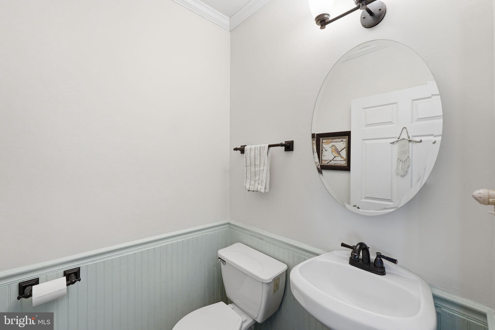 19608 Gott Street Poolesville, MD 20837 - Photo 34 of 43 a bathroom with a toilet a sink and mirror
